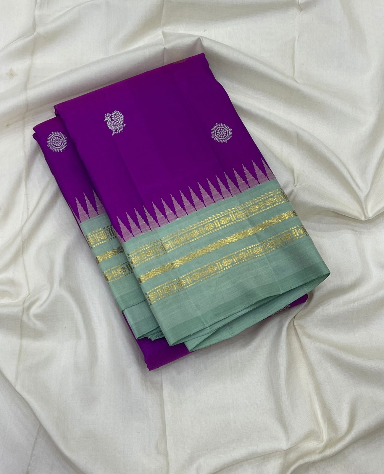 Ice blue Korvai Varisaipet border of orchid purple Kanjipuram saree with Kaal Irangiya temple edge and antique gold zari
