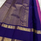 Close-up of petite gold zari buttas on raspberry pink Kanjivaram saree body