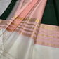 Pure Silk Kanjeevaram in Forest Green with layered Pink Ivory Varisaipet and traditional gold zari
