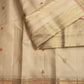 Close detail of the exclusively designed meenakari orange butta inside the zari-woven kamalam butta.