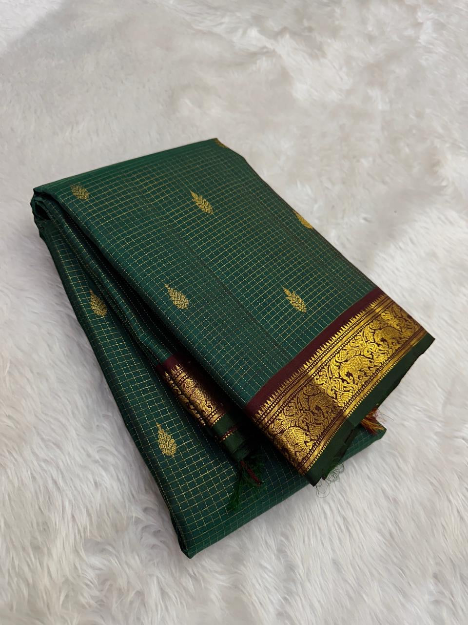 Pure Silk Kanjeevaram saree with traditional Yaanai elephant zari border