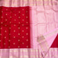 Close view of the rose-pink Kanchipuram border with broad floral zari registers and fine geometric bands.