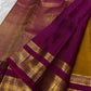 Pure Silk Kanchipuram Butta saree with antique gold zari buttas and purple border