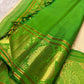 Soft ivory and emerald green Kanjipuram Korvai saree folded view