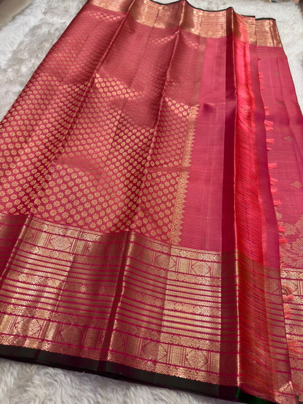 Intricate stacked antique gold zari border on Raspberry Pink Kanchipuram saree