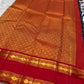 Deep navy Vairaoosi KanchiPattu pure silk saree folded, showing zari shimmer texture
