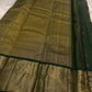 Close view of petite Gandaberunda zari buttas on the green silk body.