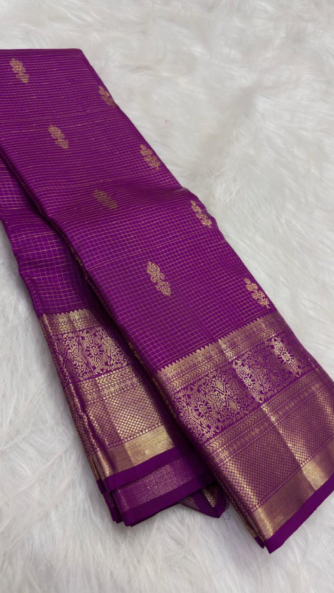 Close view of antique-gold Zari Kattam grid on Vadamalli Purple silk.