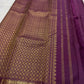 Burnt Orange selvedge finishing the border on Vadamalli Purple Kanchipuram saree.