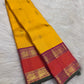 Detail of purple and coral Kanchipuram border with Mayil zari band and dark-green selvedge.