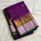 Traditional gold-zari buttas across rich Purple silk.
