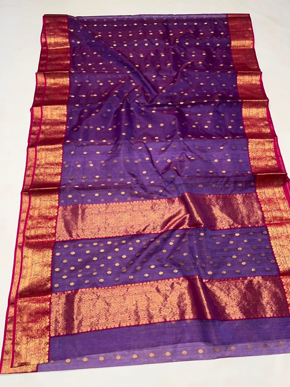 Royal Purple Katan Silk Chanderi saree with warm gold weaving catching the light.