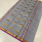 Close-up of purple and gold zari border on silver grey Chanderi silk