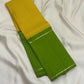 Green Pure Kanchipuram silk saree folded with yellow checked panel and slim zari woven border