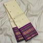 Close view of traditional gold zari border motifs on Warm Ivory Kanjivaram saree