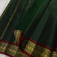 Green pure Kanchipuram silk saree body with fine vertical antique gold zari lines visible across the surface, available in the USA