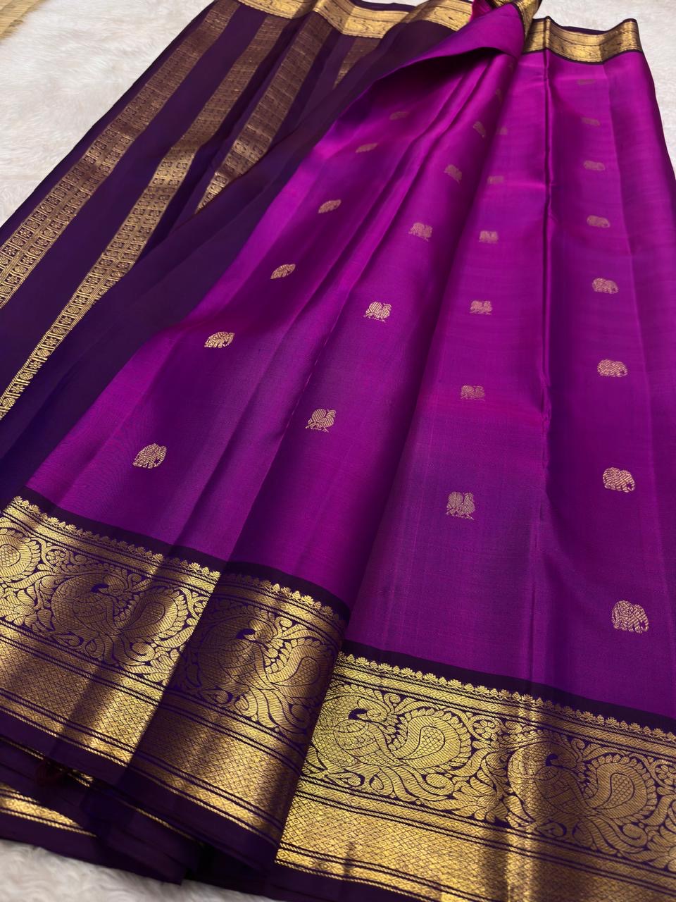 Purple handloom Kanjivaram silk saree with traditional gold zari close-up
