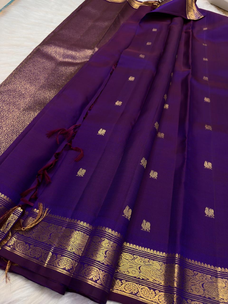 Deep Violet Purple pure silk Butta saree with petite traditional gold zari peacock border.