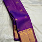 Rich Mayil gold zari border on handwoven Kathiripoo Purple Kanchipuram saree.
