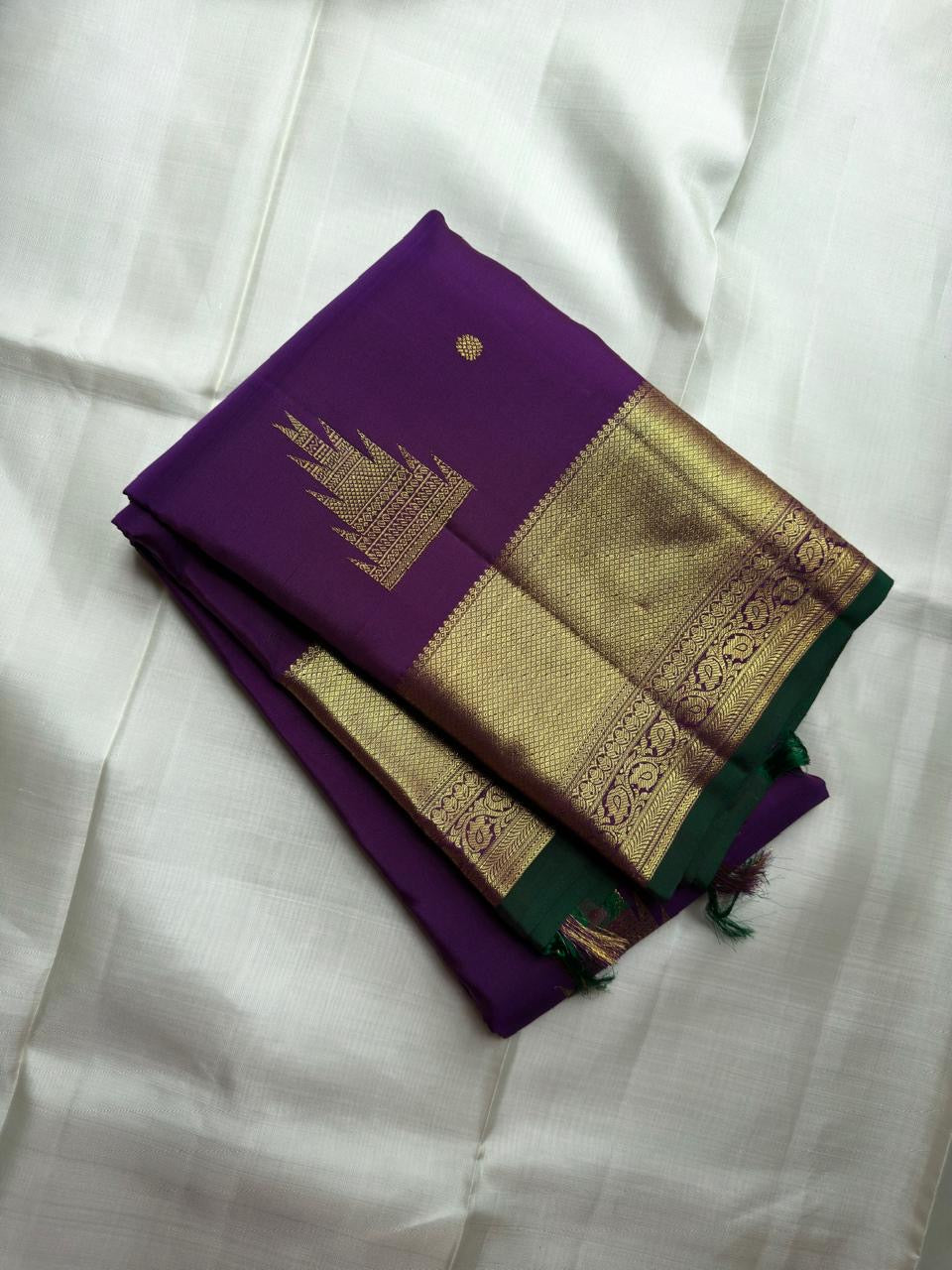 Close view of Thazhampoo Reku zari butta on Royal Purple Kanchipuram silk.