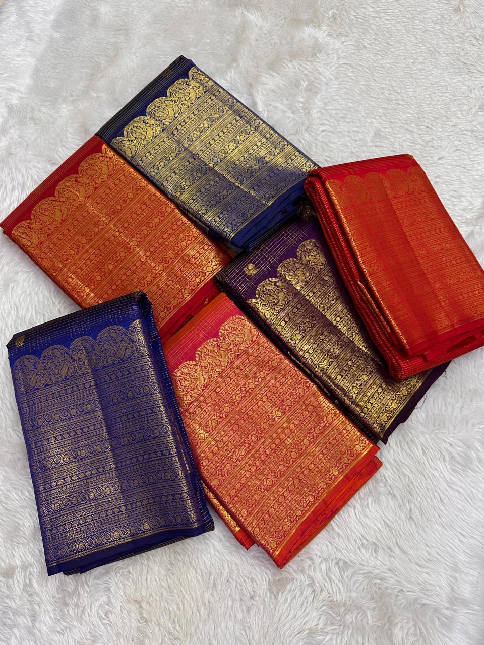 Floral classic-gold zari ornament against Deep Kathiripoo Purple silk.