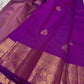 Close-up of gold zari mayil peacock butta on deep purple Kanchipuram silk saree — Idam Living