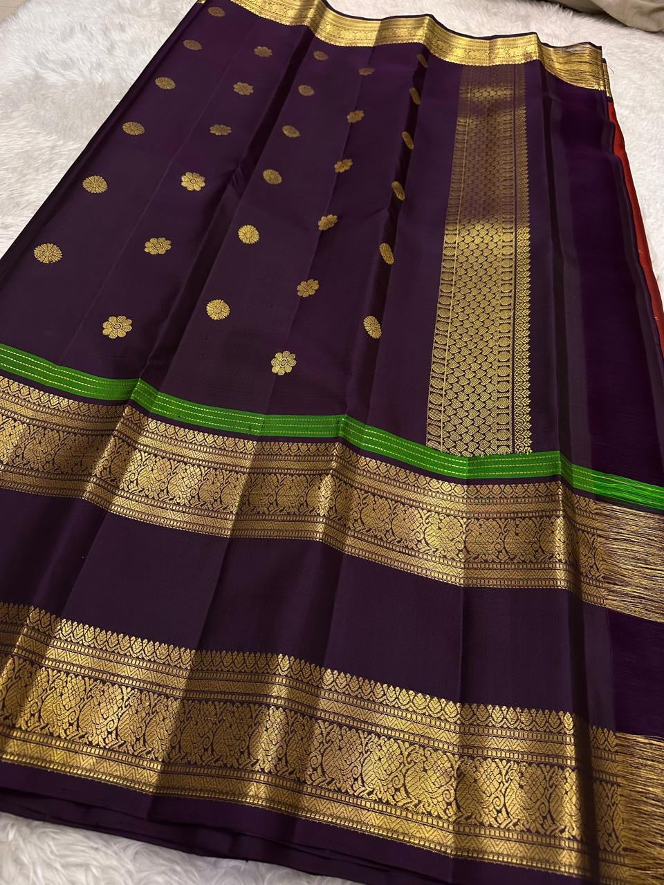 Royal purple Pure Silk Kanjivaram Rettapet saree with rust red border and Yaanai motif craftsmanship
