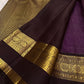 Purple Kanjivaram silk showing traditional gold zari motifs woven across the body.