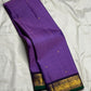 Purple Kancheepuram saree with petite peacock Korvai border, folded view
