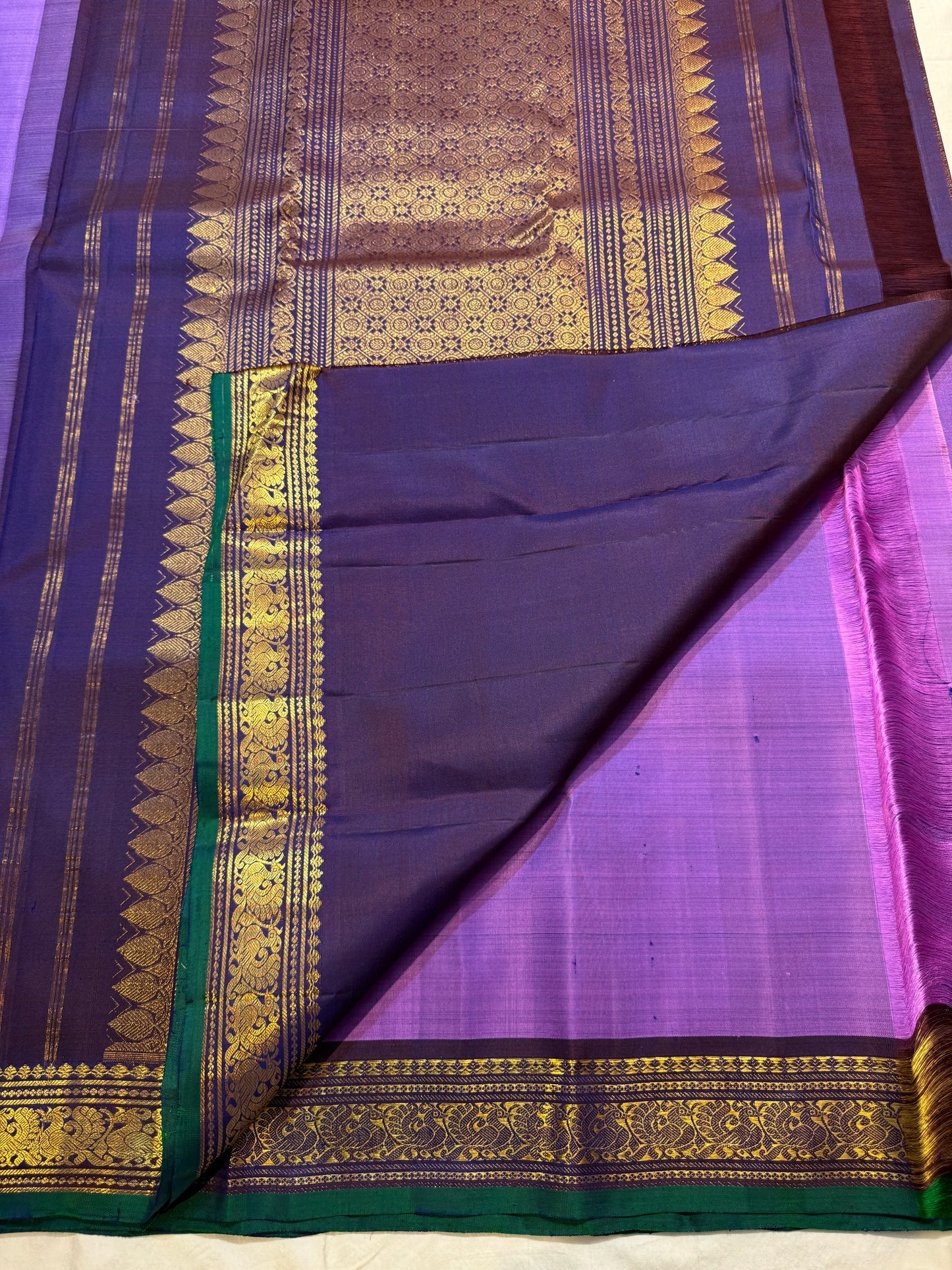 Navy-purple petite peacock pallu detail on Korvai saree