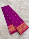 Jewel-toned violet korvai saree with elegant mayil chakram butta motifs