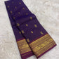 Purple lightweight Kancheepuram silk saree with intricately woven peacock border