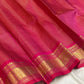 Close view of radiant pink Kanjivaram saree body with Pavun butta in gold zari kattam grid — Idam Living