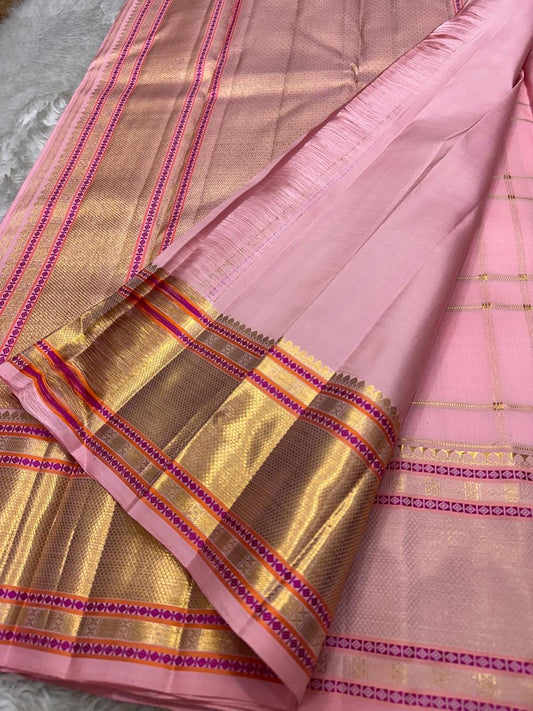 Close view of radiant pink Kancheepuram saree body with Gandaberunda butta in blended zari and silk thread — Idam Living