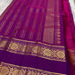 Royal purple pure silk Kanchi saree folded showing gold zari buttas