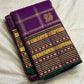 Purple Kanchipuram silk showing gold and silver-toned motifs positioned inside a precise zari grid.