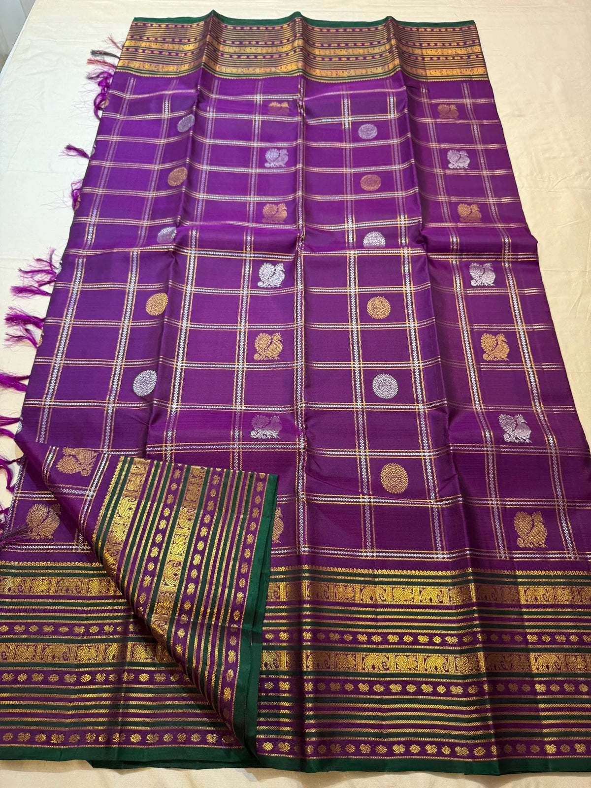 Full handwoven purple Zari Kattam saree with stacked traditional border and deep green outer edge.