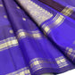 Layered purple Rettapet border with broad gold zari bands and floral register.