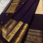 Traditional Kanchipuram silk saree in regal aubergine with peacock zari border detailing