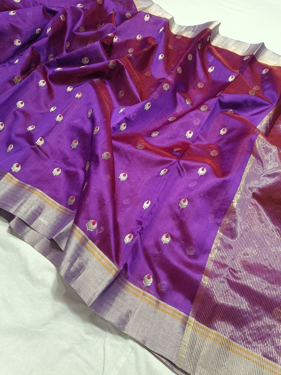 Close-up of the broad silver-toned border with fine gold lines on a Royal Purple Chanderi silk saree