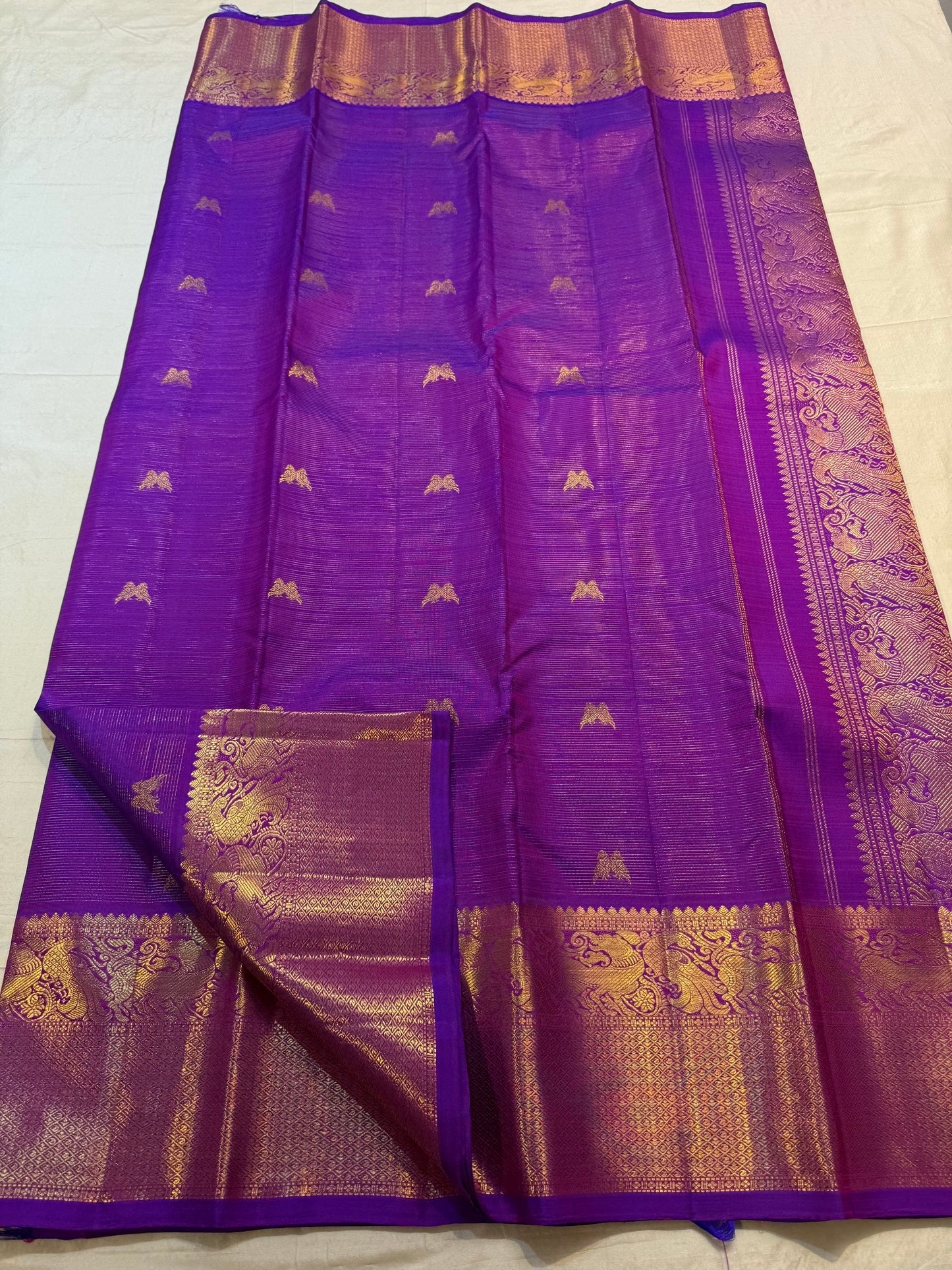 Close view of handwoven Twin Bird zari buttas across Kathiripoo Purple Vairaoosi silk.