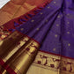 Deep Violet Pure Silk Vaira saree opened to show petite buttas, Arakku border and repeating gold zari Yazhis.