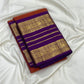 Close view of repeated gold zari registers on Kathiripoo Purple Varisaipet border.
