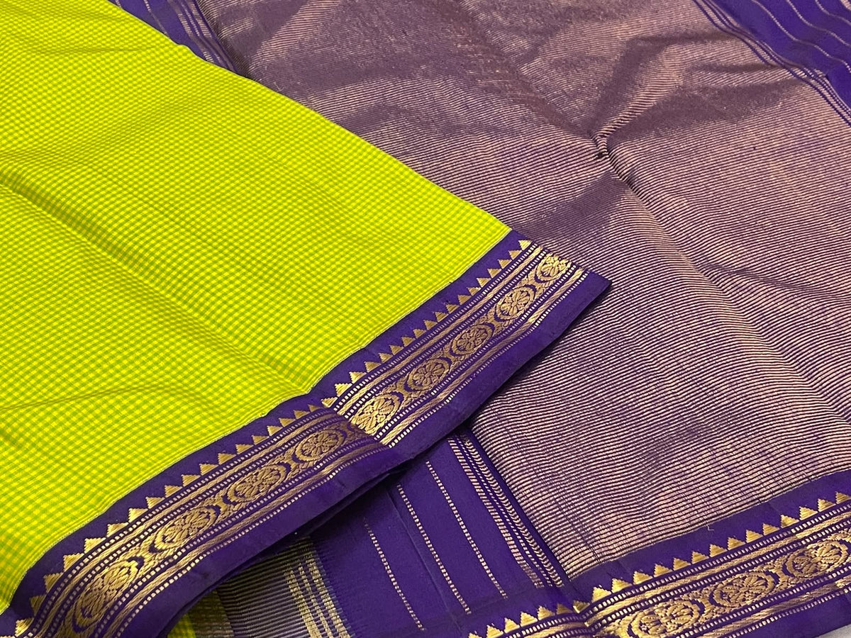 Lime-green checked Kanchipuram saree beside its purple border with gold floral medallions