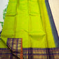 Radiant lime-green Pure Silk Kanchipuram Varisaipet saree with petite zari buttas and stacked contrast border.