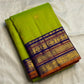 Bright lime-green silk body contrasted with a deep indigo-purple traditional woven border.