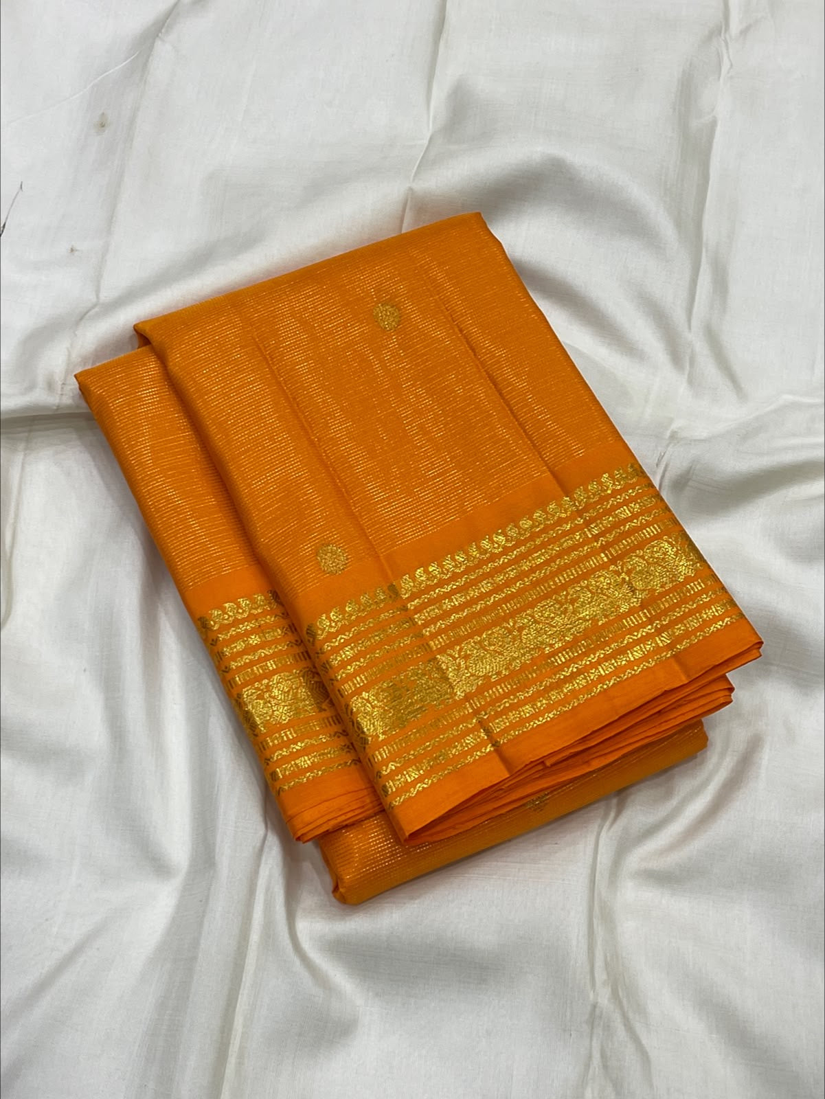 Radiant Marigold Orange KanchiPattu silk saree, folded view — Idam Living