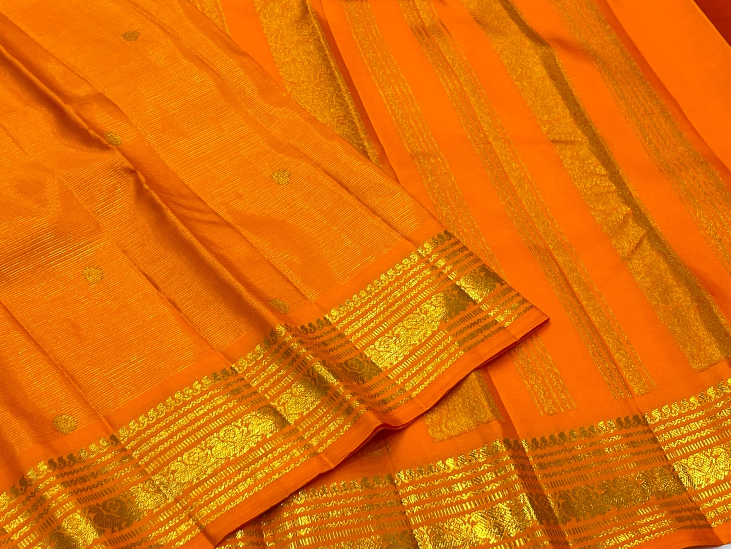 Radiant Marigold Orange KanchiPattu silk saree draped, full length view — Idam Living