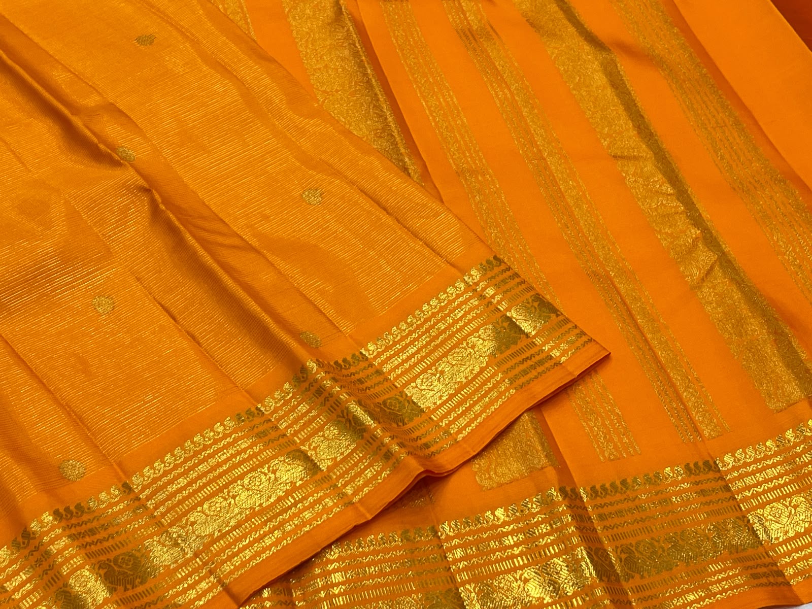 Radiant Marigold Orange KanchiPattu silk saree draped, full length view — Idam Living