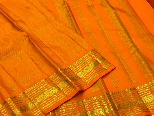 Radiant Marigold Orange KanchiPattu silk saree draped, full length view — Idam Living